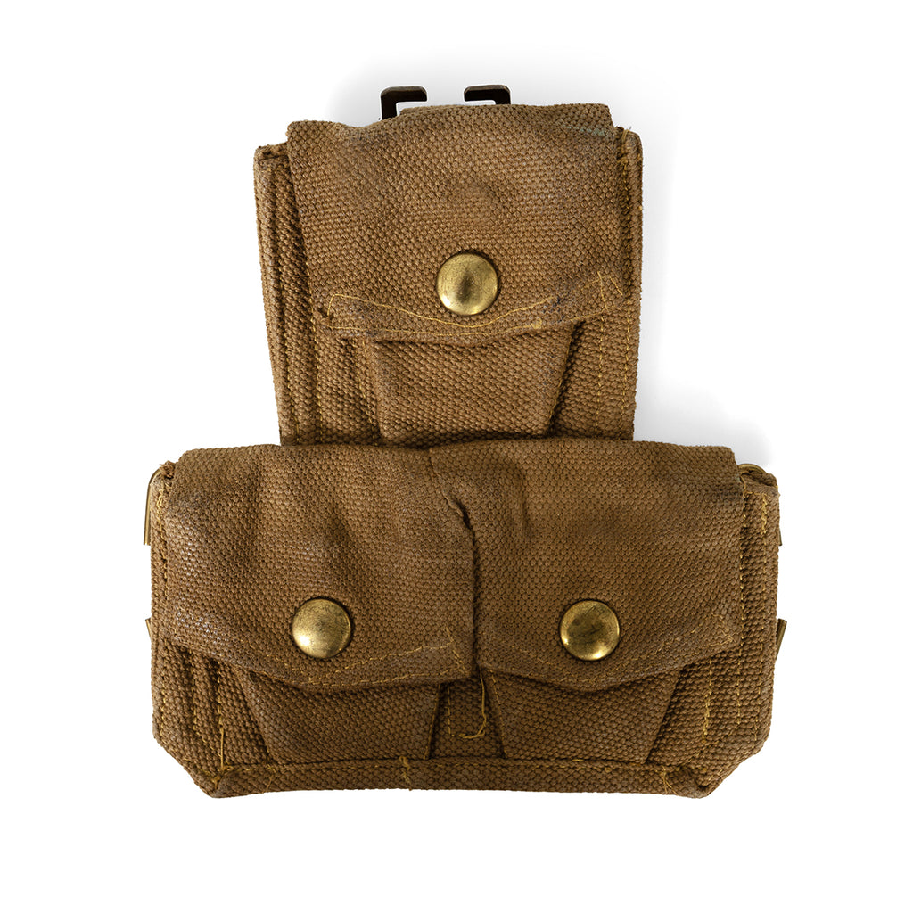 Studio shot of Italian 37 Pattern webbing pouch showing the canvas texture and patina on the brass button closures.
