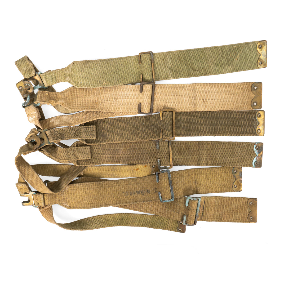 Stack of multiple genuine 37 Pattern L-straps exhibiting color variations from khaki to olive drab, suitable for military reenactment.