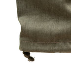 Detail of the ankle hem on East German NVA combat trousers featuring an adjustable drawstring for a customizable fit.