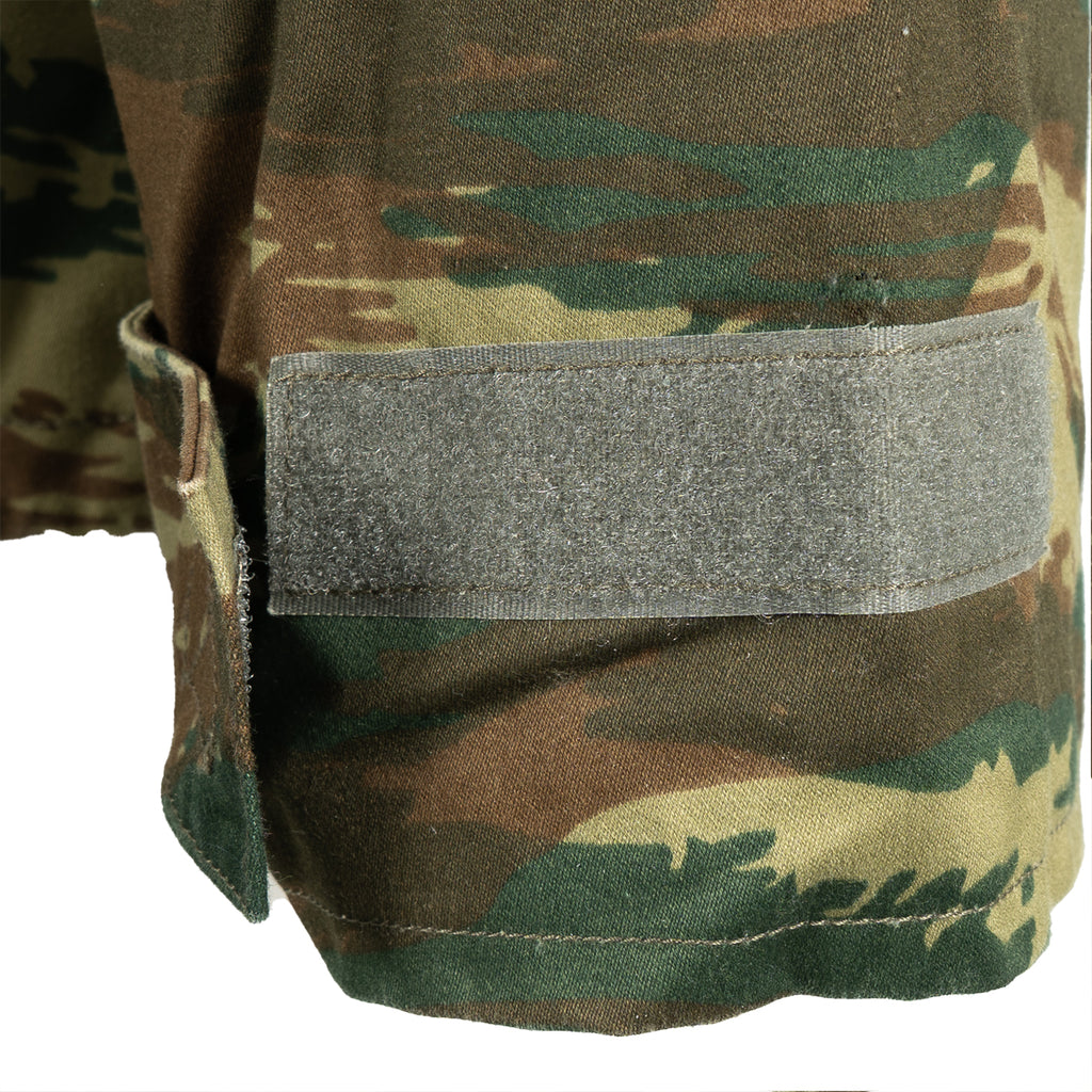 Close-up of the adjustable Velcro cuff on the sleeve of a genuine Greek military Lizard Camo M65 jacket.