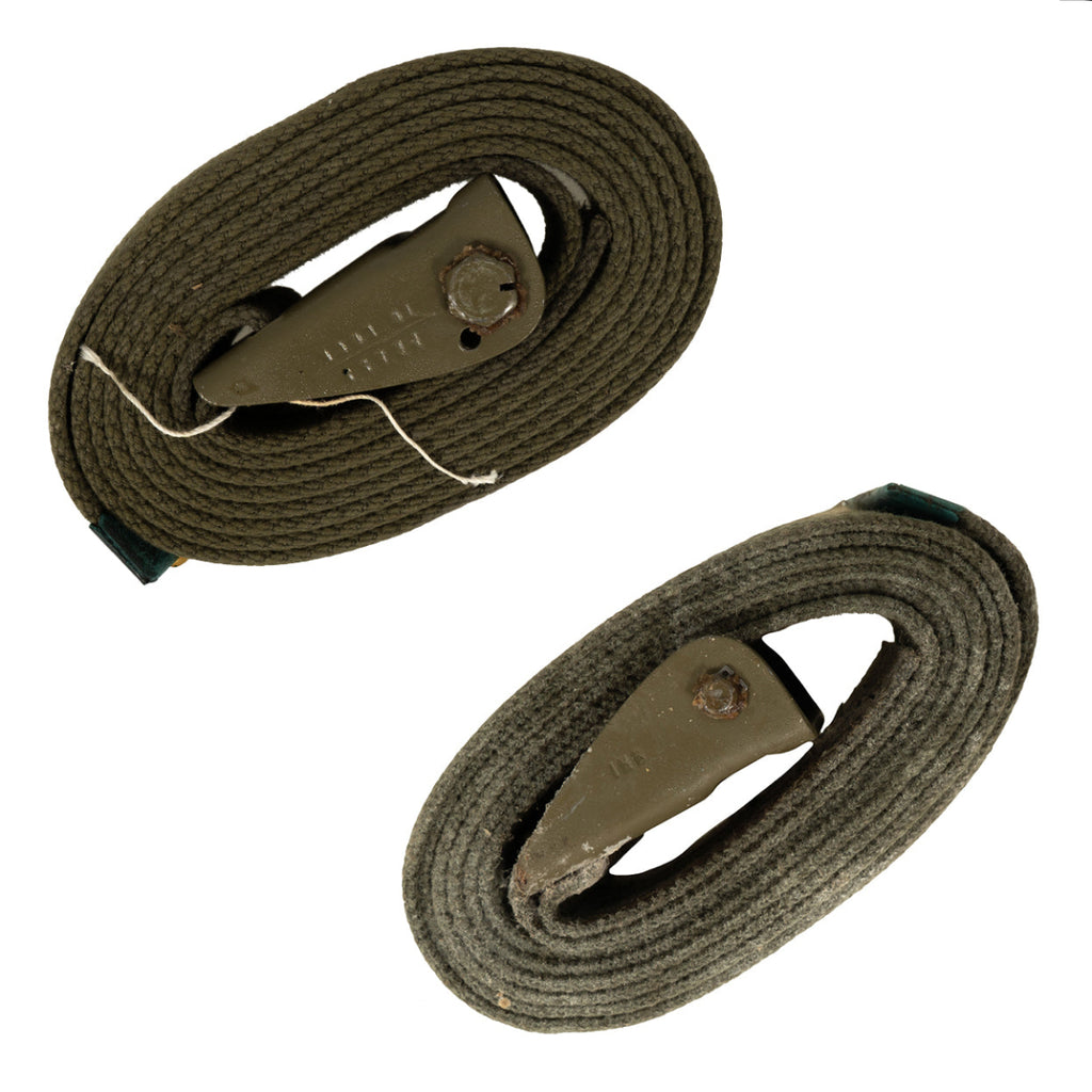 Two military-style web belts, one labeled Grade 1 and the other labeled Grade 2, on a white background.
