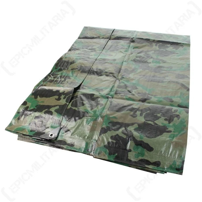 Folded woodland camo tarpaulin 200cm x 300cm showing corner reinforcement