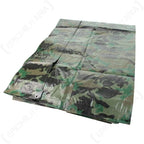 Folded woodland camo tarpaulin 200cm x 300cm showing corner reinforcement
