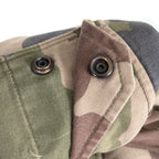 Detail of metal ring press-stud snap closure on the pocket flap