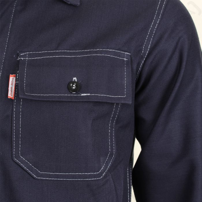 Close-up of chest pocket and red Sicur System tag on navy Italian work jacket