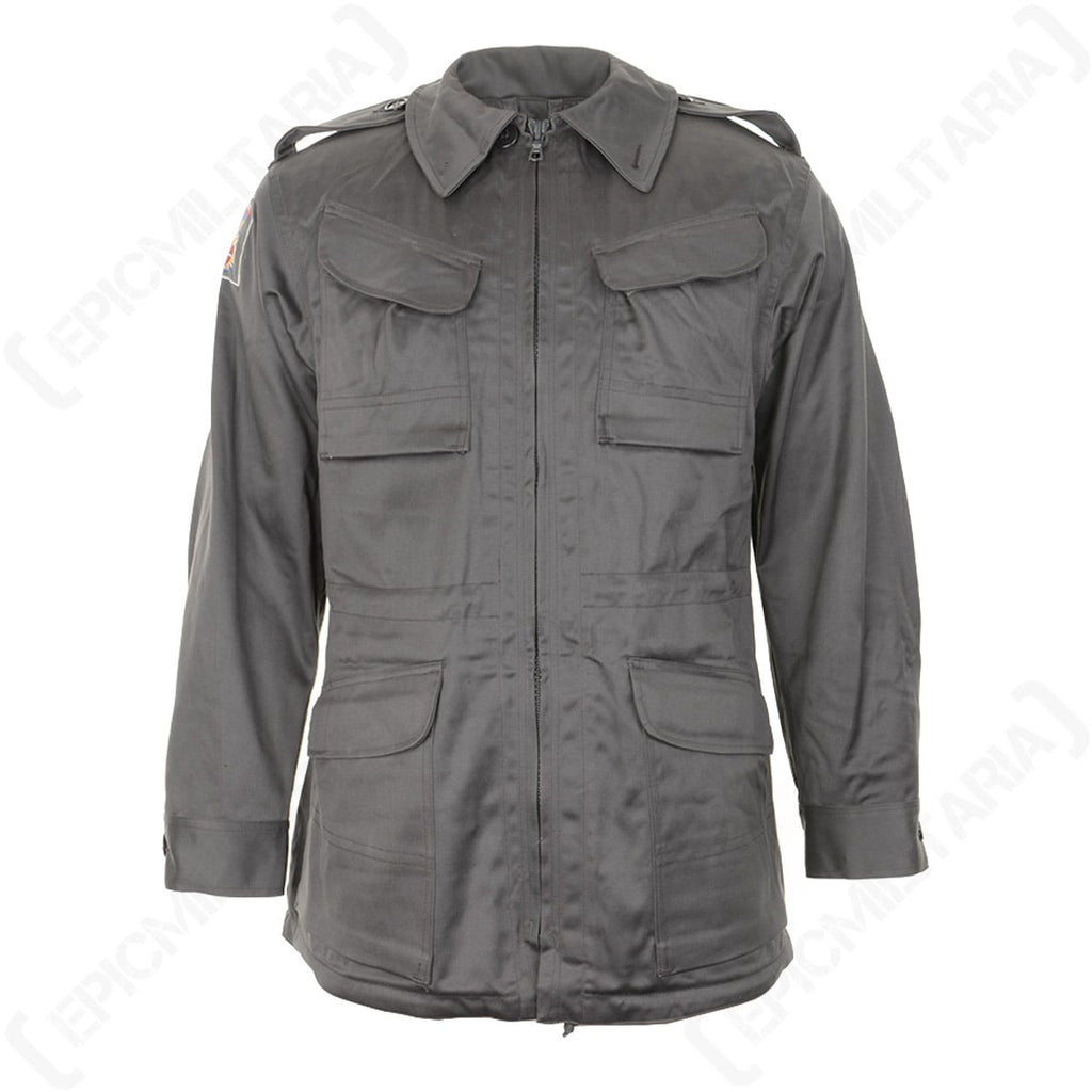 Original Danish Army M71 Civil Defence Parka in muted grey-green featuring front cargo pockets, epaulets, and a full zip closure.