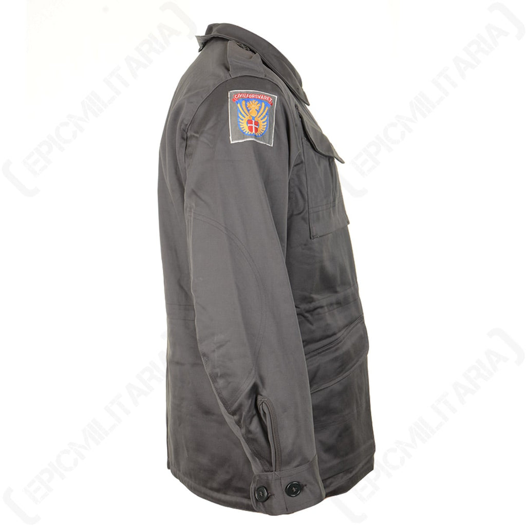 Side profile of the Danish Civil Defence Force M71 Parka highlighting the distinctive shoulder patch insignia and rugged utilitarian design.