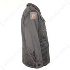Side profile of the Danish Civil Defence Force M71 Parka highlighting the distinctive shoulder patch insignia and rugged utilitarian design.