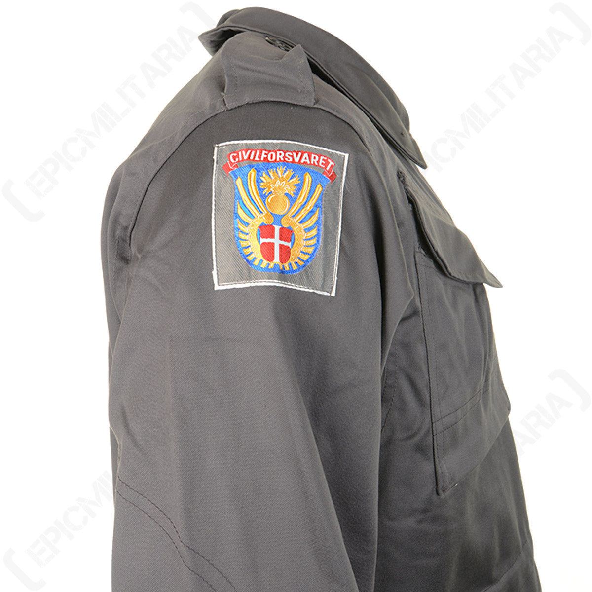 Detailed shot of the official Civil Defence Force insignia patch on the shoulder of the authentic Danish M71 military parka.