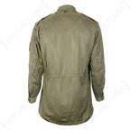 Rear view of the vintage French M64 field jacket, highlighting the classic utility cut, waist adjustment, and durable military design.