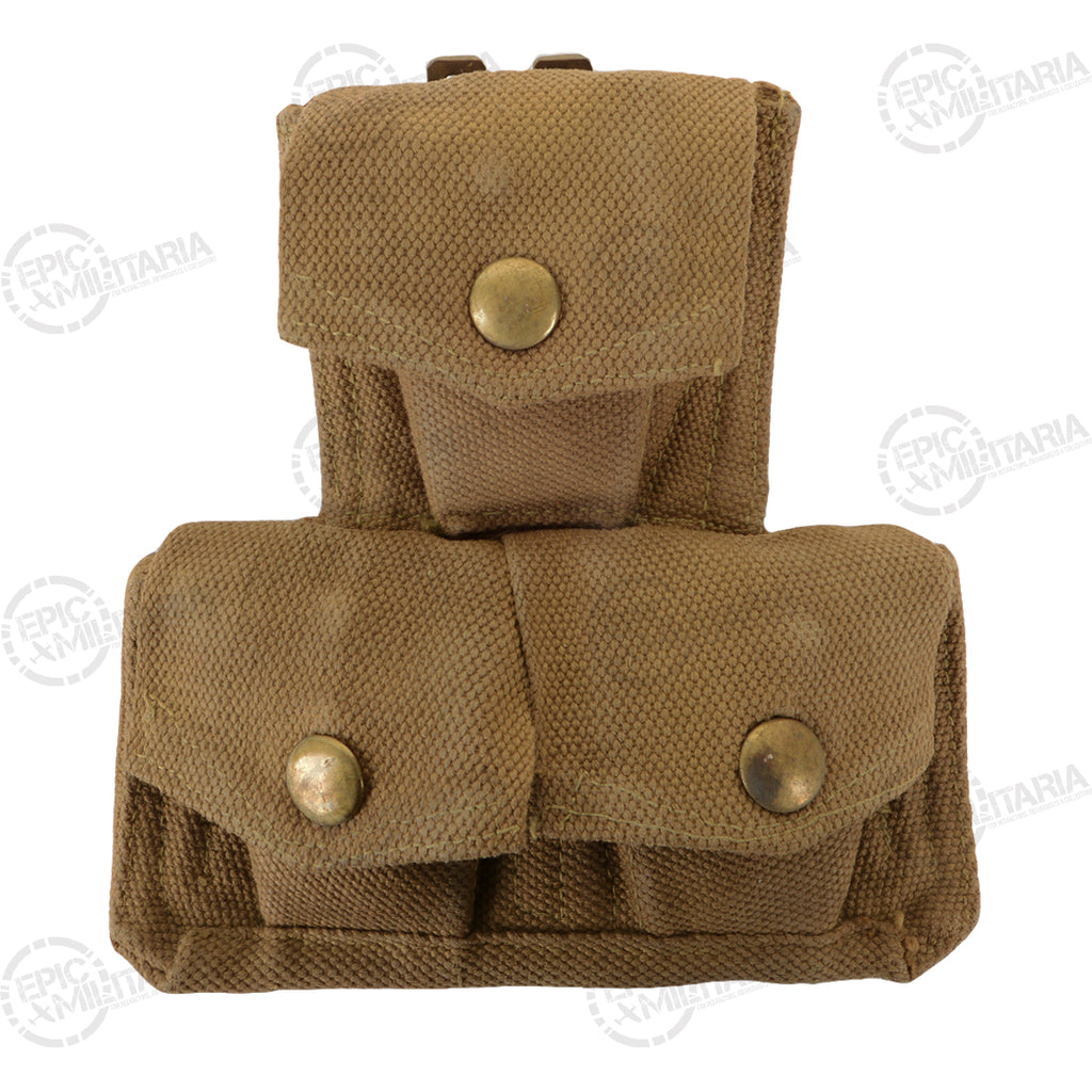 Front view of an authentic khaki cotton canvas British Army triple ammo pouch featuring brass hardware.