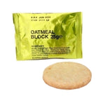 Genuine British Army oatmeal ration block in gold foil packaging with a single circular biscuit placed in front.