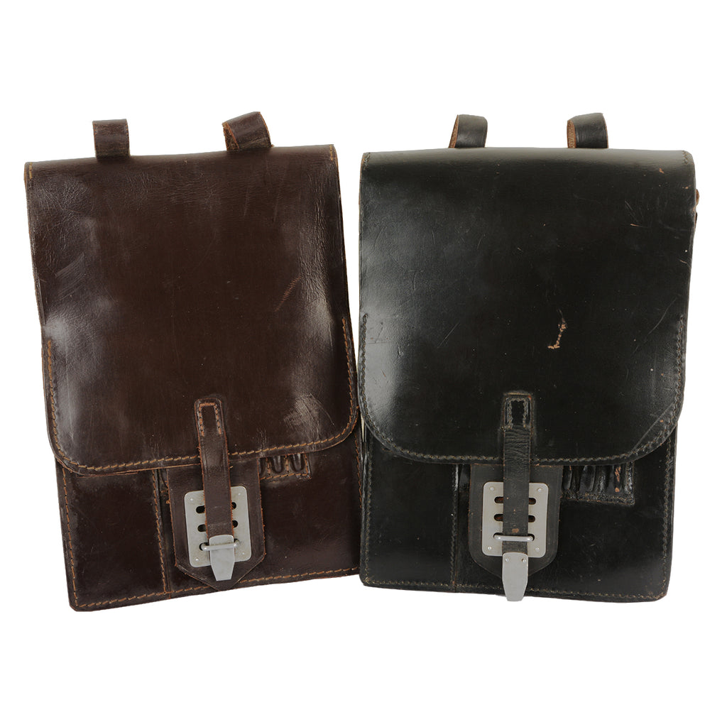 Two original Austrian Army leather map cases in black and brown, featuring metal tuck-lock buckles.