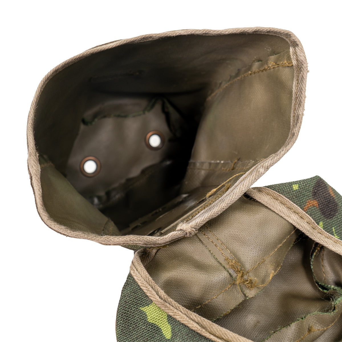 Top-down interior view of the canteen pouch, highlighting the bottom metal drainage rivets designed to prevent water accumulation.