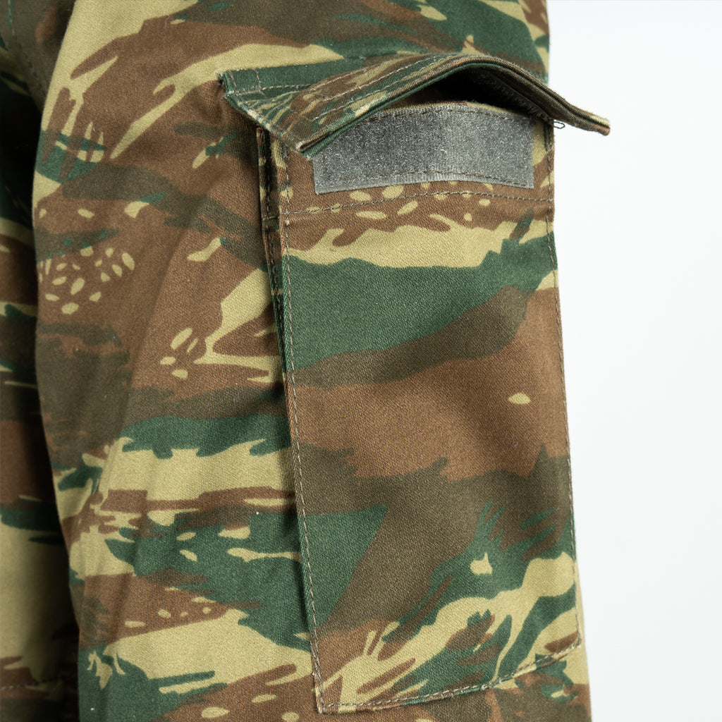 Close-up of the rugged tactical sleeve pocket on a Greek Army M65 field jacket, showcasing the unique Lizard Camo fabric.