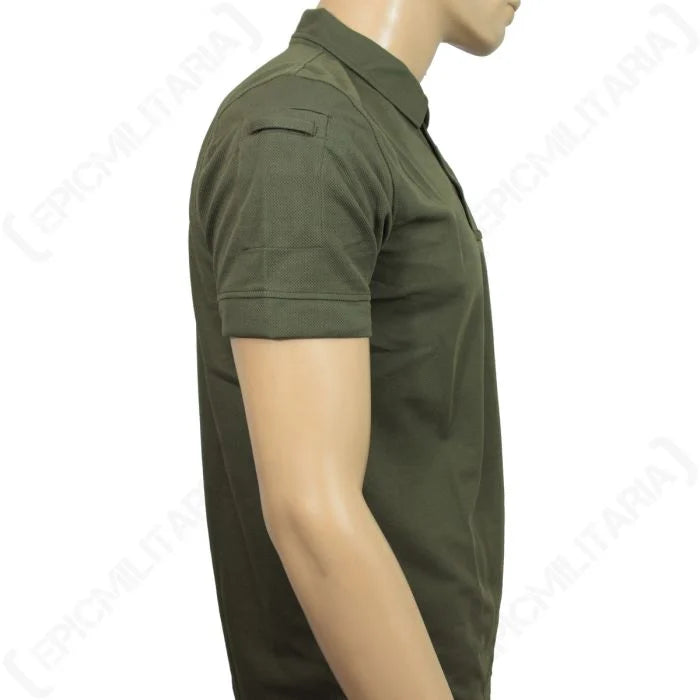 Profile view of the olive green tactical polo sleeve with low-profile pocket detail.