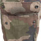 Detailed view of open thigh cargo pocket showing internal snap fasteners