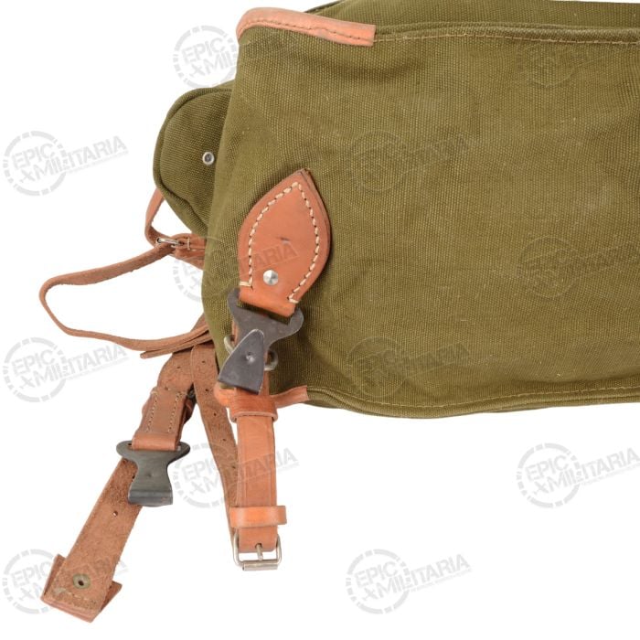 Close-up of the metal buckles and leather strap attachments on the bottom of the Romanian Army pack