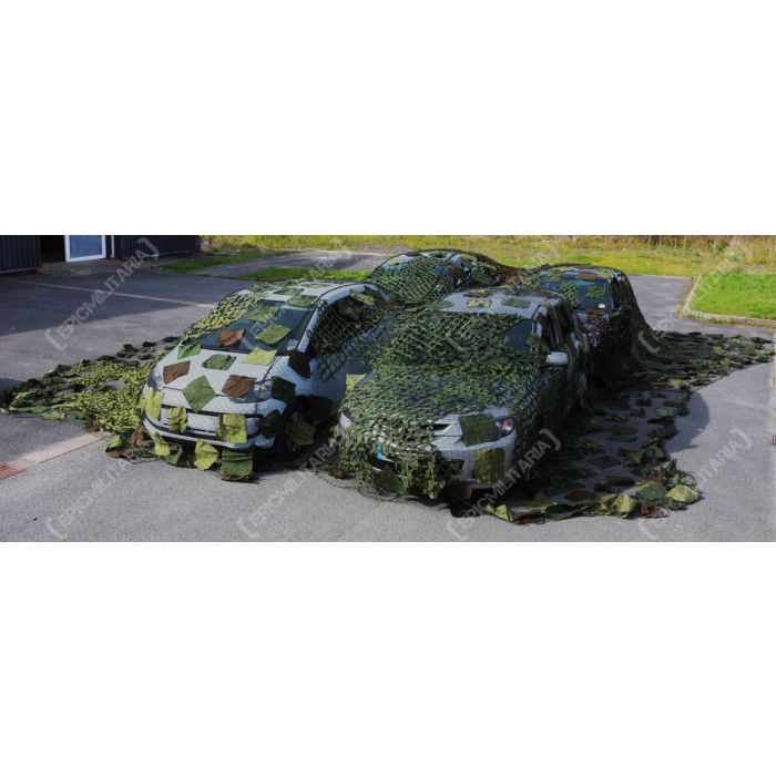 Front angle of Czech Army vehicle camouflage netting draped over cars
