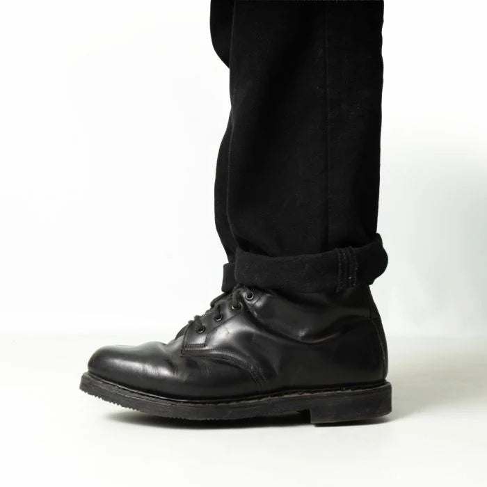 Side profile view of black leather Austrian Army double buckle combat boots