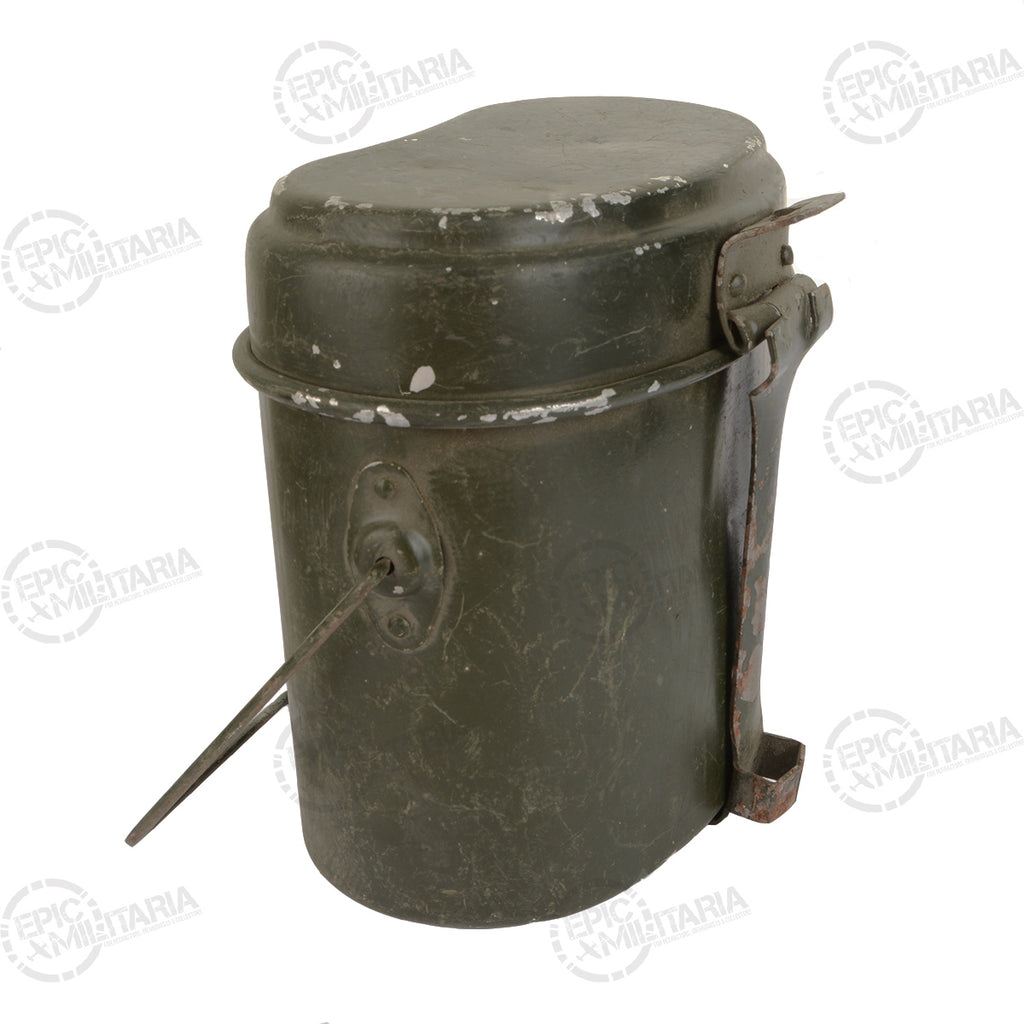 Side view of a vintage Romanian military mess tin with the metal carry handle partially extended.