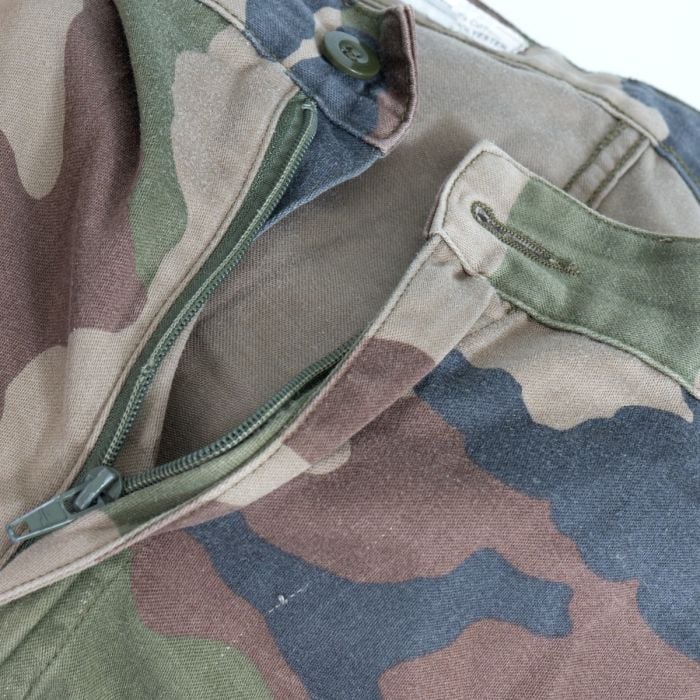 Close-up of olive button waist fastening and zip fly on French Army F2 trousers