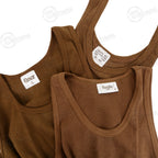 Close-up of three genuine SADF mesh vests showing inner neck label details including manufacturer branding and military specifications.