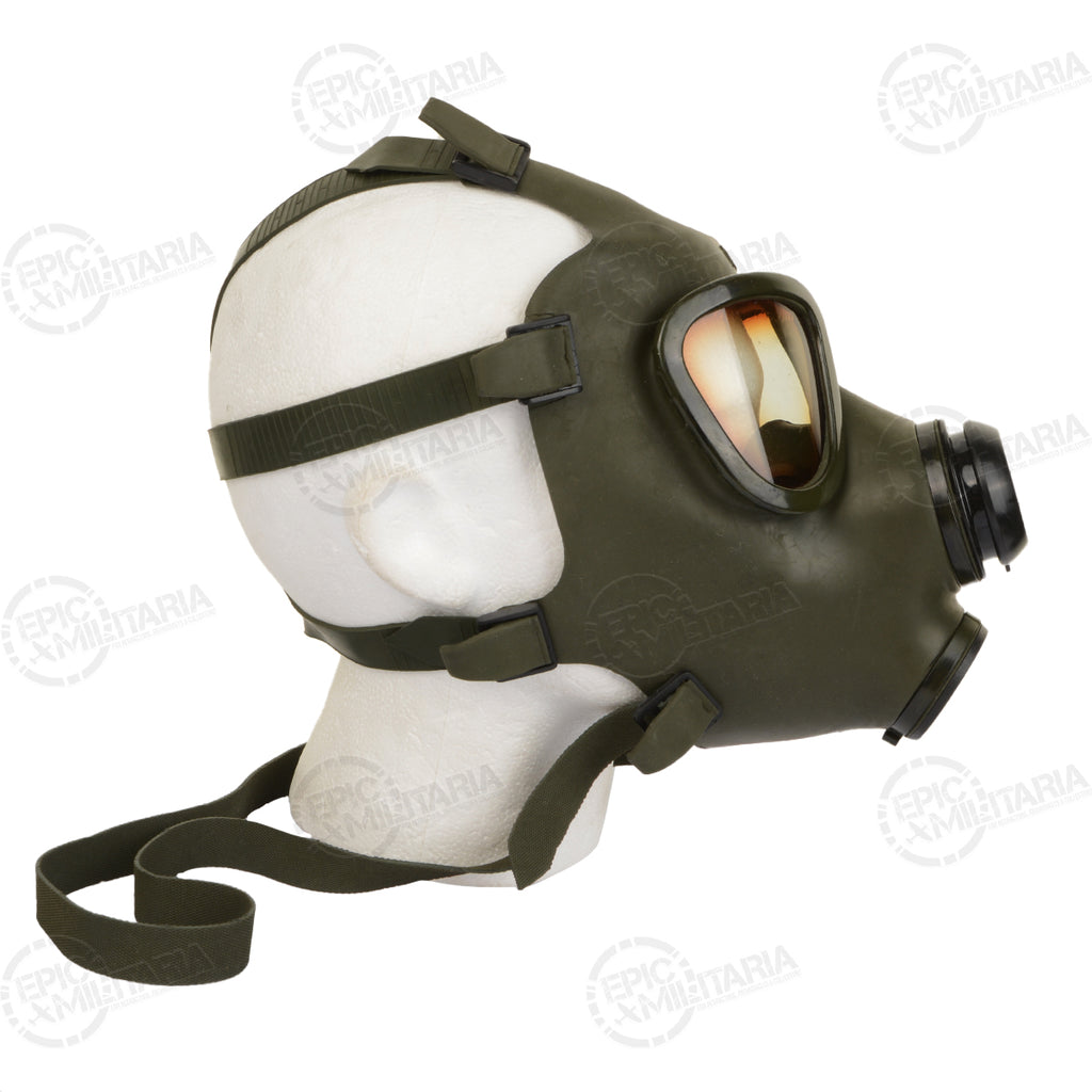 Right side profile of the Romanian M74 gas mask, emphasizing the durable construction and secure head harness system for military use.