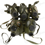 A collection of five original Romanian Army M74 gas masks, highlighting the variations in lens condition for this military surplus gear.