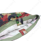 Interior view of Swiss M71 helmet cover showing herringbone cotton lining and metal spring attachment clips