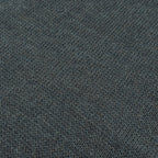 Close-up of the grey wool fabric texture illustrating the double-layered knit insulation of the Swedish military scarf.