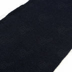 Detailed close-up of the dark blue wool knit texture from the Swedish military scarf showcasing its dense, insulating quality.