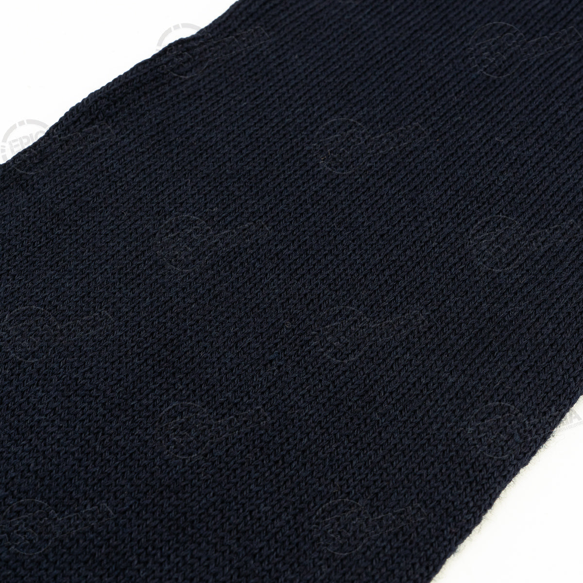 Detailed close-up of the dark blue wool knit texture from the Swedish military scarf showcasing its dense, insulating quality.