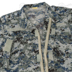 Close-up of the shirt interior, showing the open zipper, hook and loop fasteners on pockets, and the size tag detail.