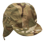 Front side view of the genuine British Army MTP winter hat featuring a short brim and lowered fleece-lined ear flaps.