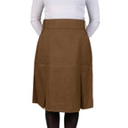 Model wearing an original British Army Barrack Dress Skirt, demonstrating the classic fit, high waist, and midi-length silhouette.