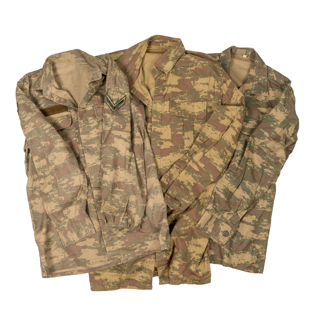 Group of three original Turkish Army field shirts showcasing the variations in the TUBITAK pixelated camouflage pattern and surplus details.