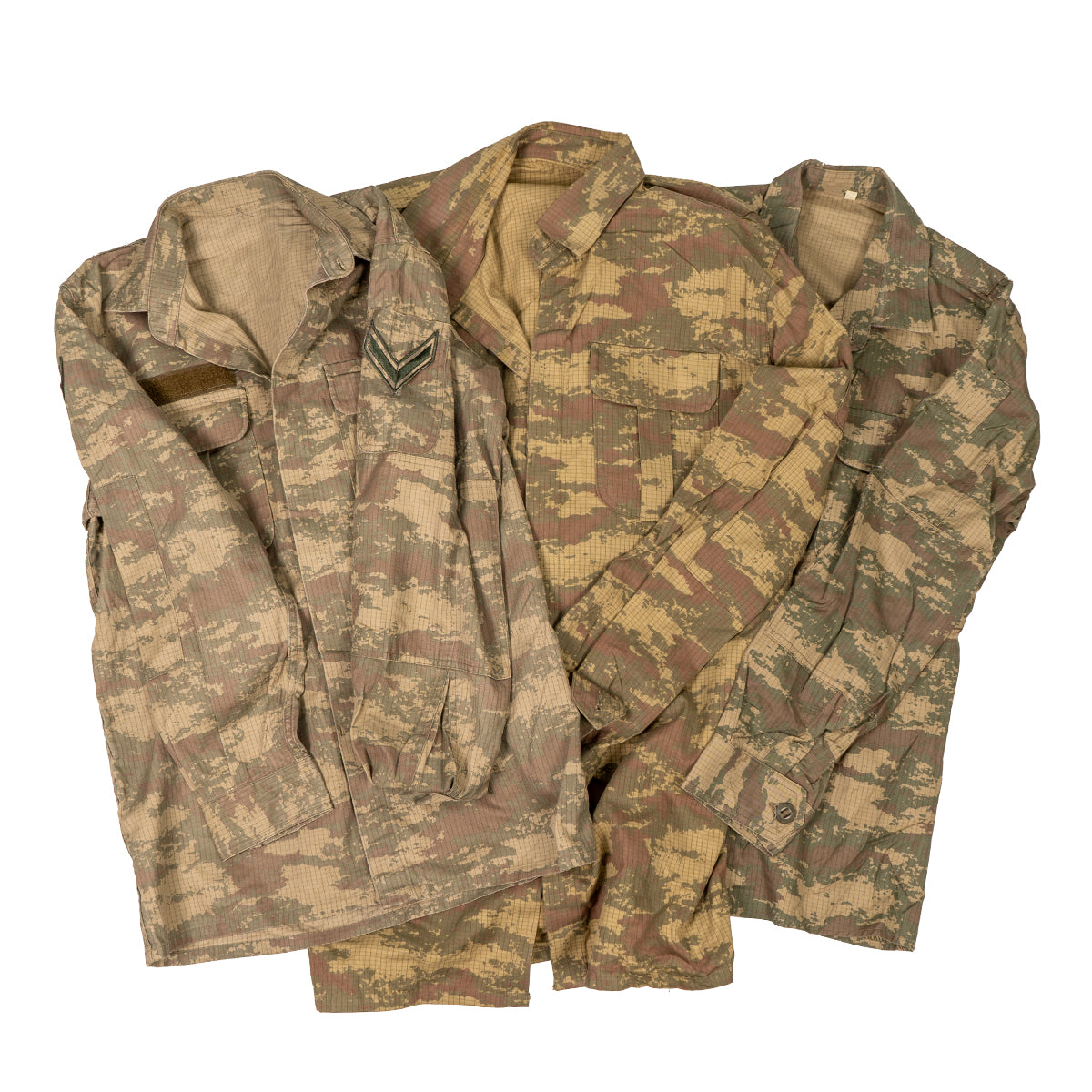 Group of three original Turkish Army field shirts showcasing the variations in the TUBITAK pixelated camouflage pattern and surplus details.