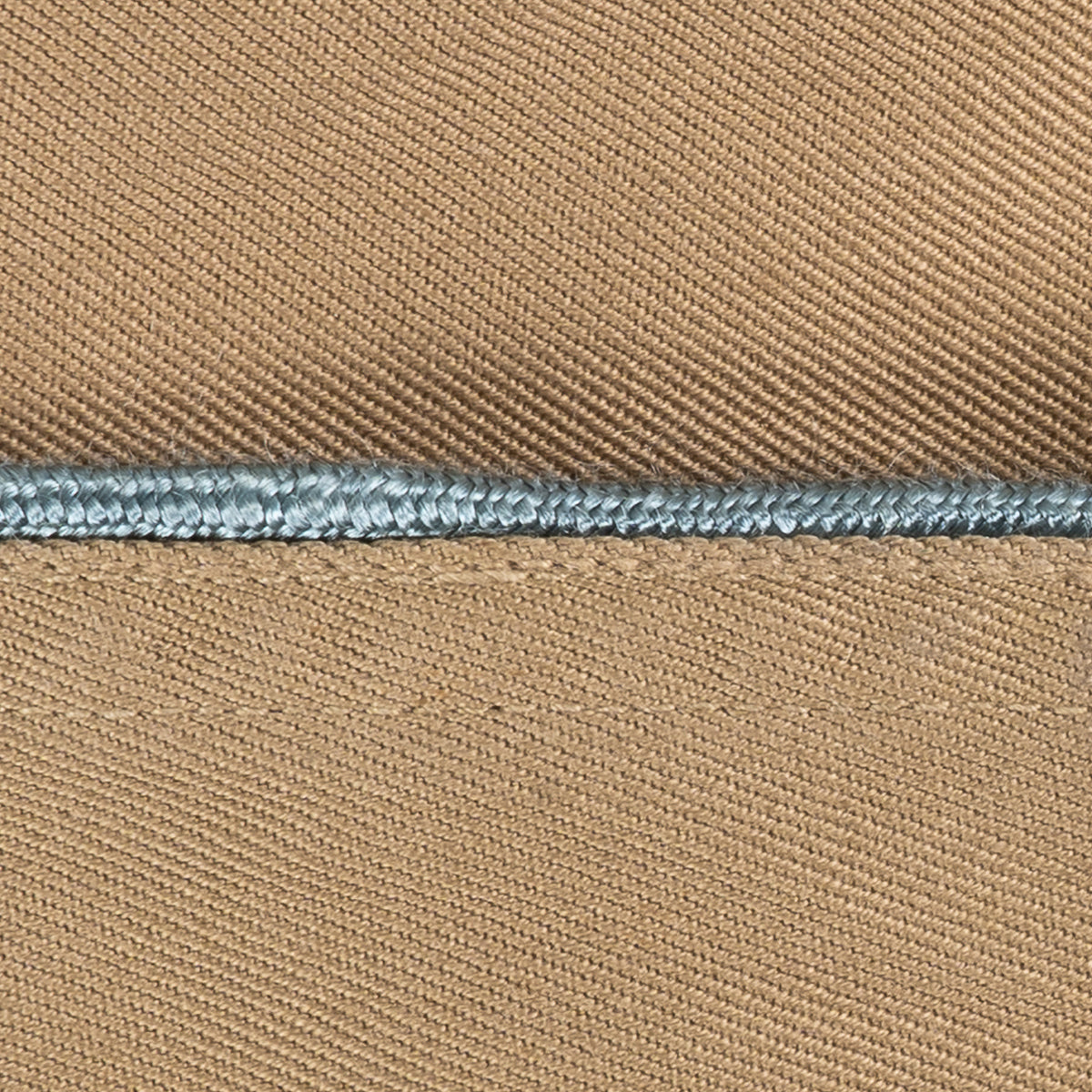 Detailed view of light blue piping trim on a WW2 US Army Khaki Garrison Cap, showing quality vintage craftsmanship.