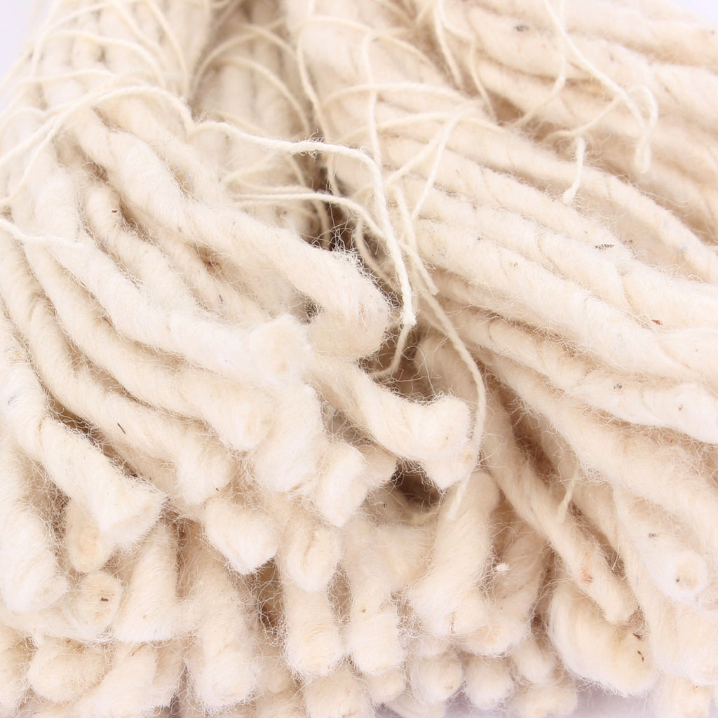 Extreme close-up detail of the natural fibers on the rifle cleaning wicks, highlighting the woven material and durable construction for firearm maintenance.