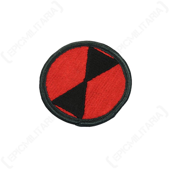 Angled view of circular US 7th Infantry Division embroidered patch with black border