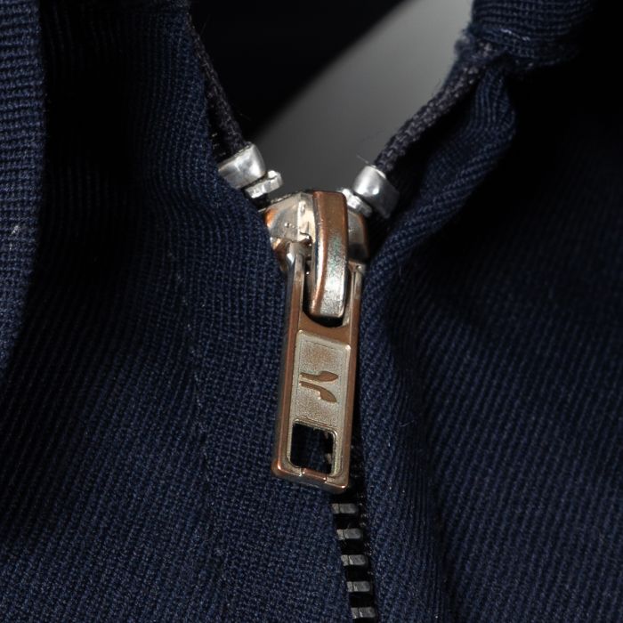 Close-up detail of the durable metal zipper and heavy-duty slider on the RAF GP jacket.