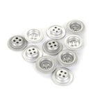 A collection of ten 18mm 4-hole silver dish buttons arranged in a triangular shape against a white background.