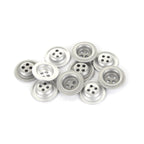 A group of eleven silver-finish metal dish buttons scattered, showcasing the durable German-made 18mm design.