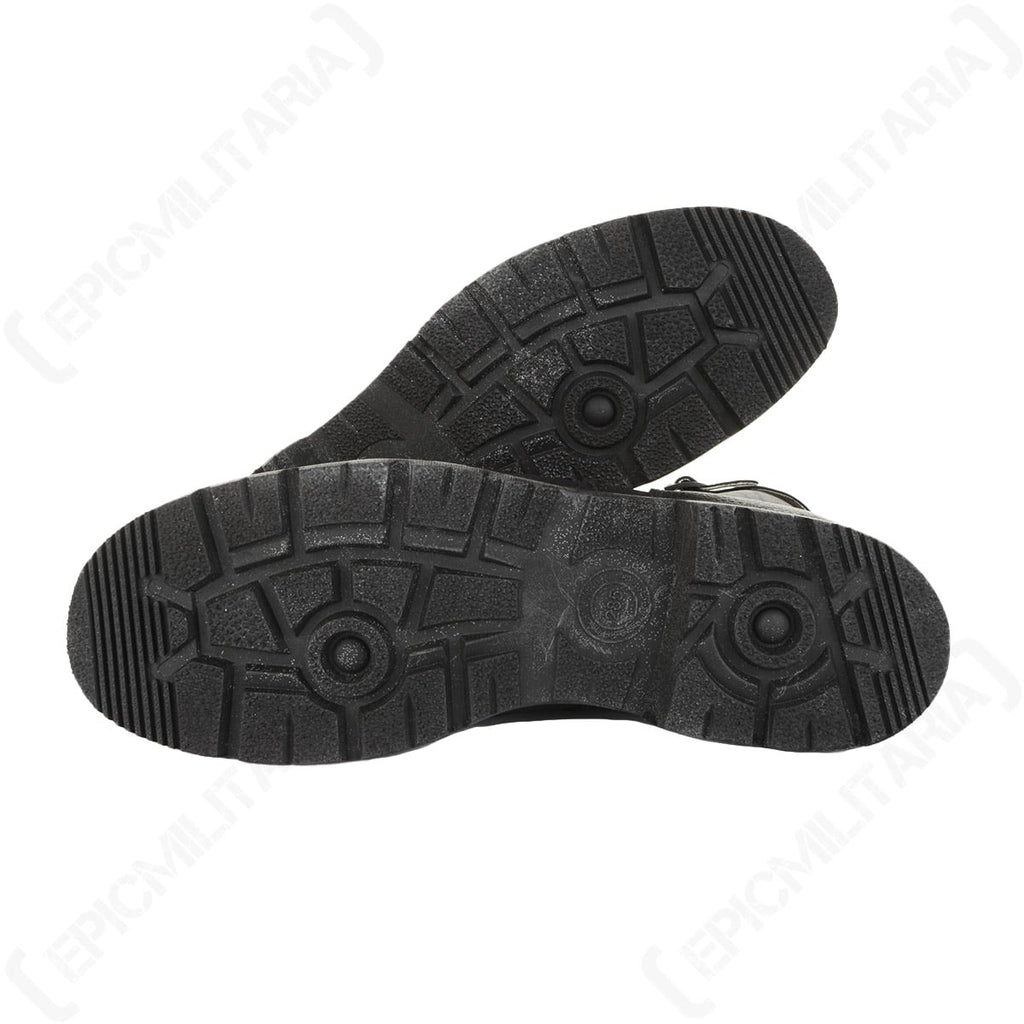 Bottom view of a pair of Bundesmarine jackboots highlighting the robust, patterned rubber soles for superior grip.