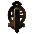Rear view of the PWRR cap badge showing the vertical brass slider attachment