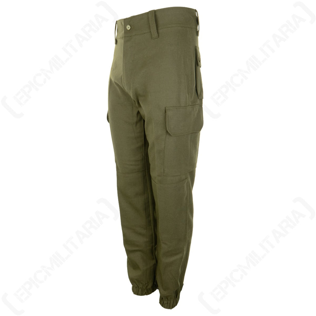 Three-quarter angle of military surplus Spanish Army field trousers, highlighting the durable cotton twill fabric and side cargo pocket design.