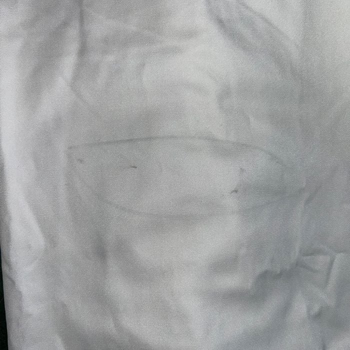 Detail of a minor service mark or stamp on the white fabric of the Grade 2 German Navy surplus shirt