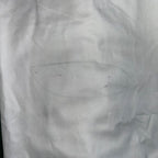 Detail of a minor service mark or stamp on the white fabric of the Grade 2 German Navy surplus shirt