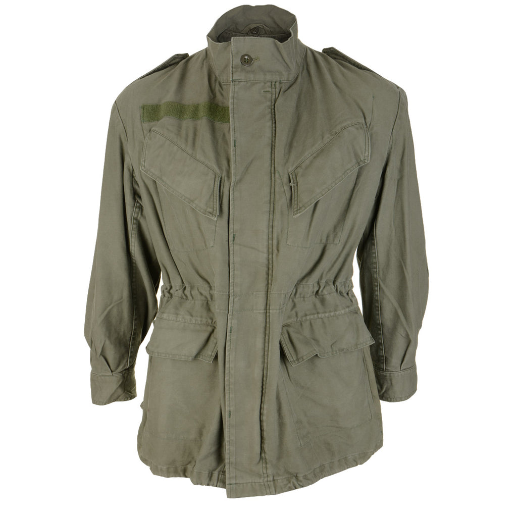 Front view of the original Belgian Army M88 olive green field jacket with four utility pockets, button-fastened wind flap, and internal waist drawstring.